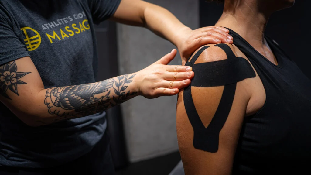 Kinesiology taping application on athlete