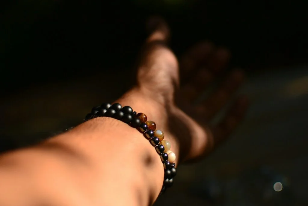 person wearing beaded bracelet